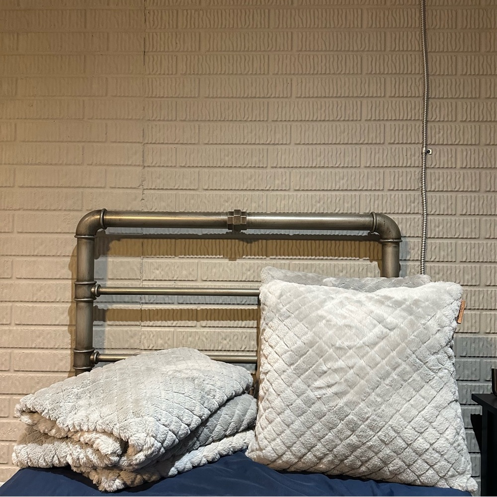 matching set of 2 gray ugg pillows and 2 gray ugg blankets.